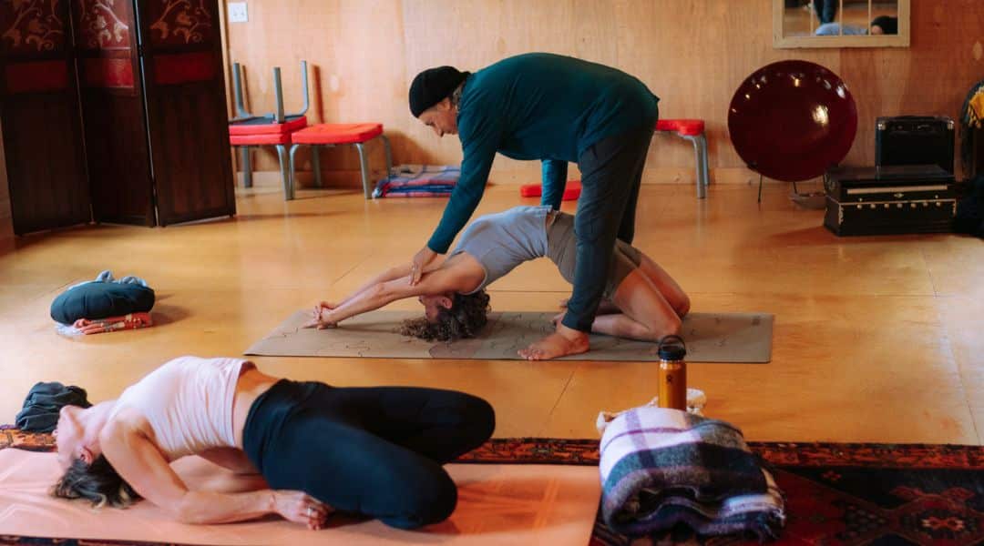 YTT - assisted pose Assisting in a yoga pose during Samaa Living Yoga Teacher Training